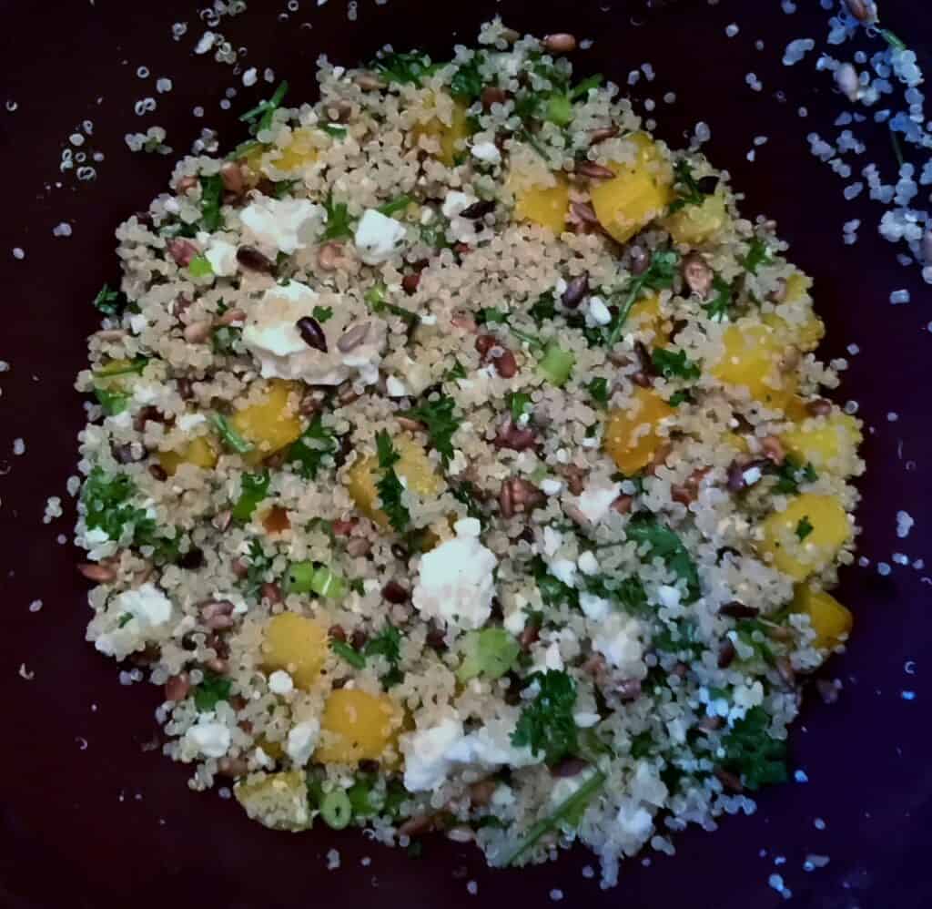 Quinoa and Golden Beet Salad with Feta in a black bowl