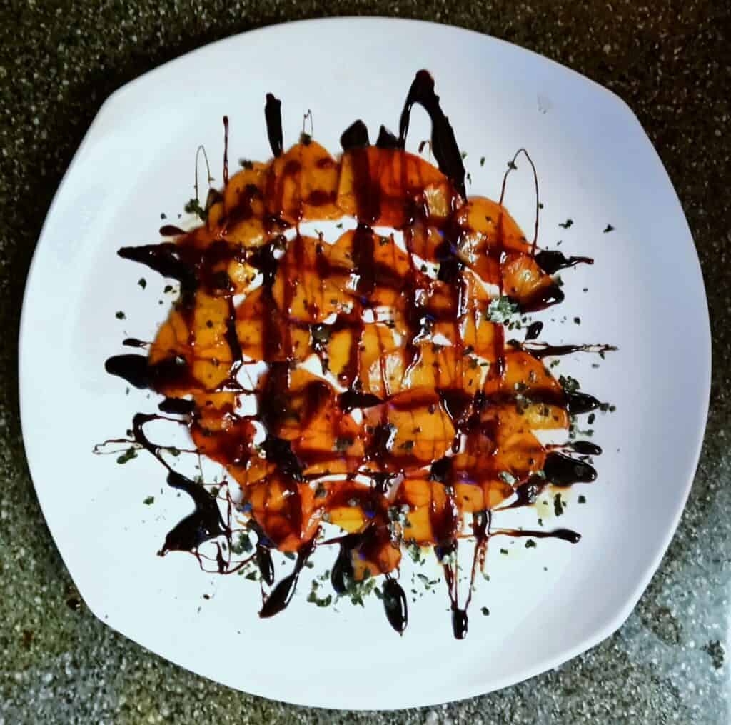 Salt-Roasted Golden Beets with Teriyaki Sauce and Nori Dust on a white plate