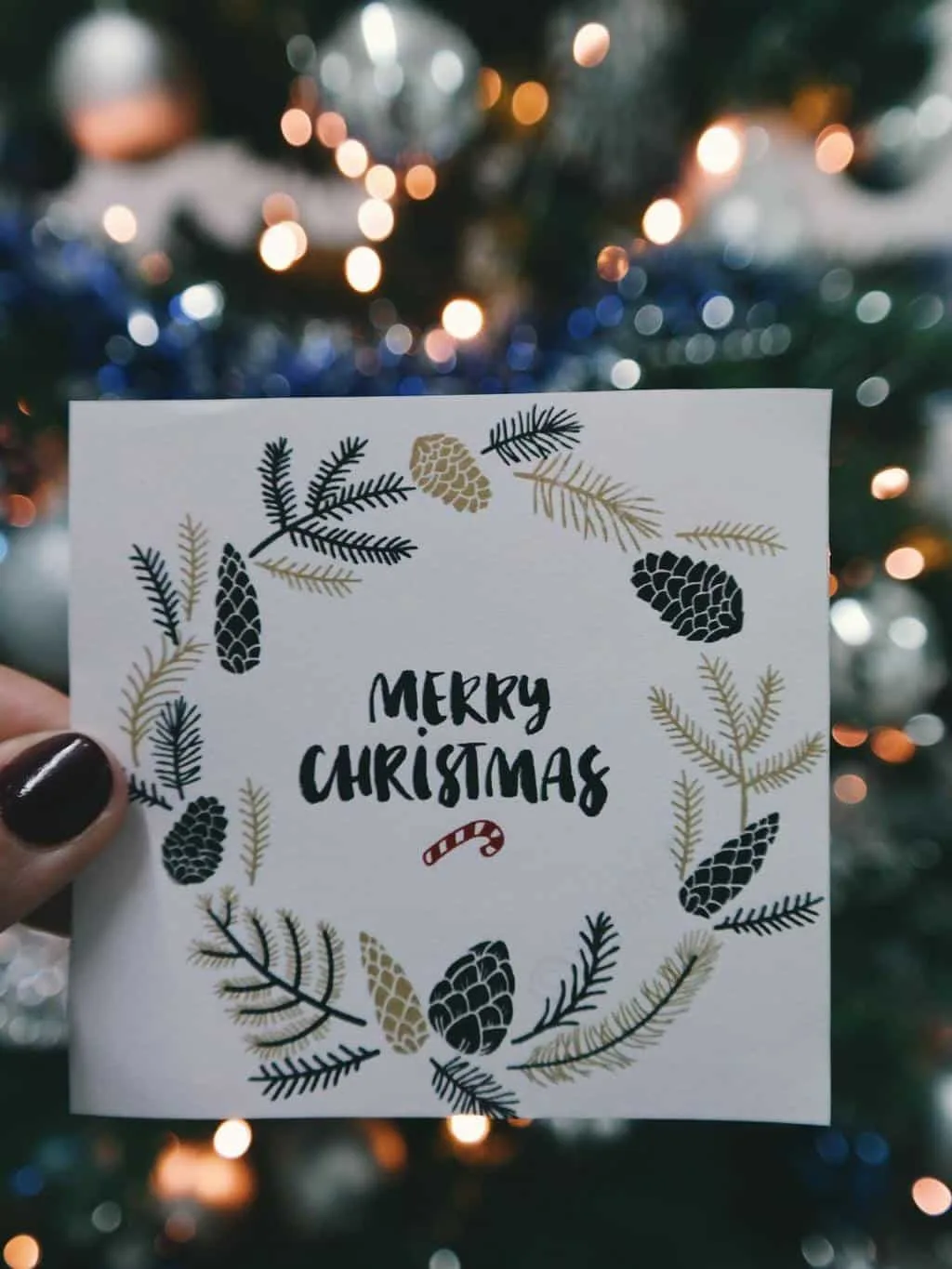 Woman holding a handmade Christmas card