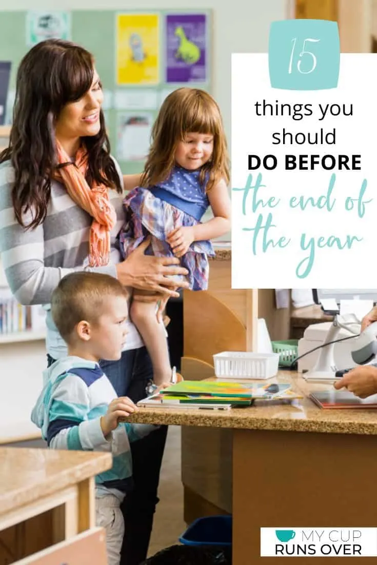 a woman and two children checking out at the library