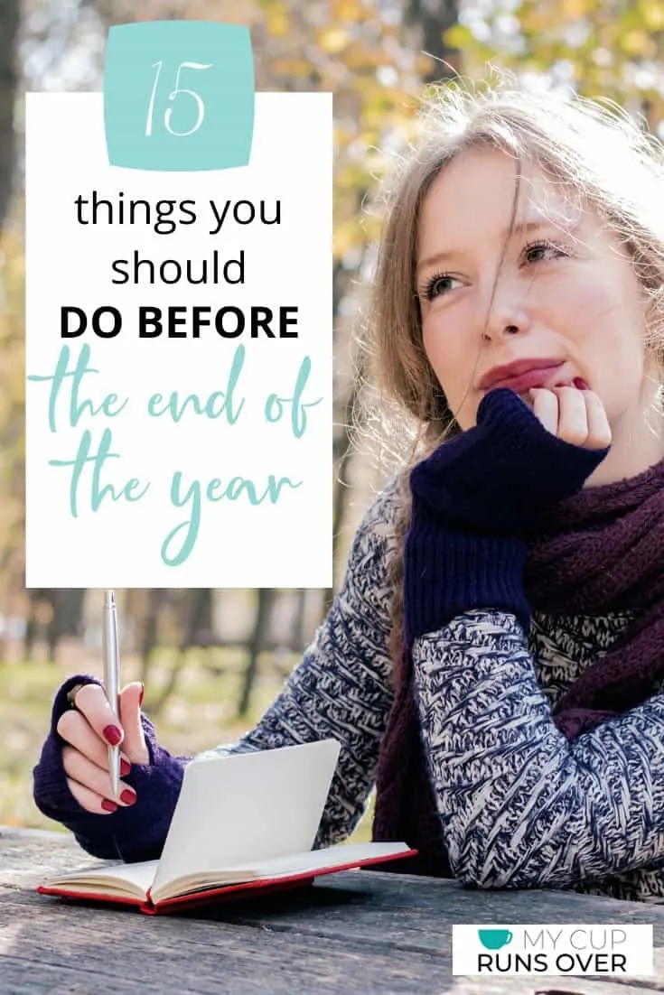 a woman reading through a journal and reflecting