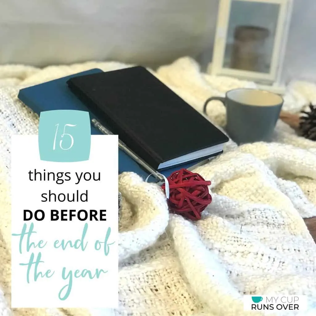 a bible and a journal resting on a blanket