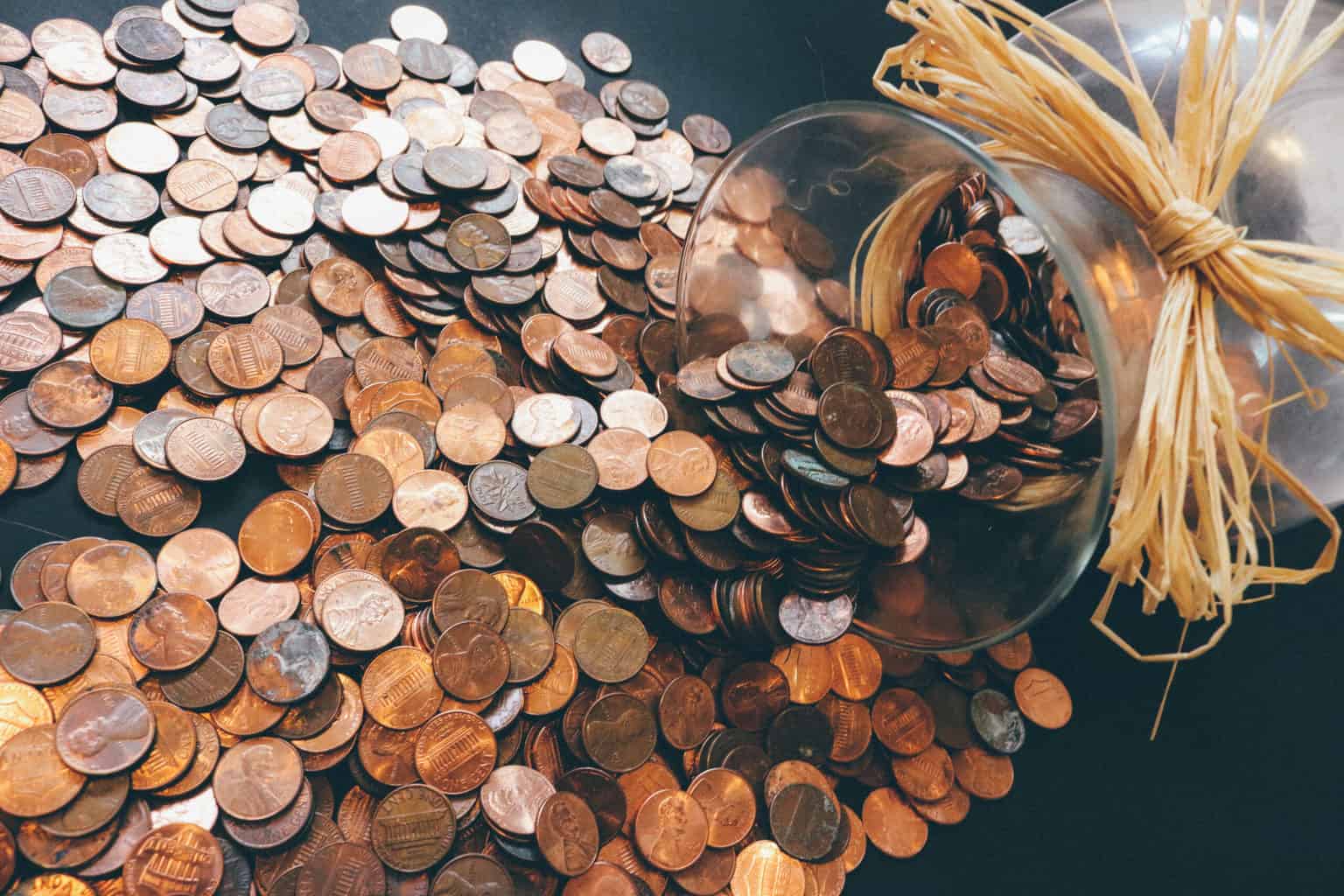 coins spilling from a jar