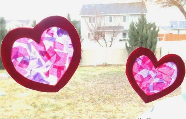 Two "stained glass" paper hearts in a window