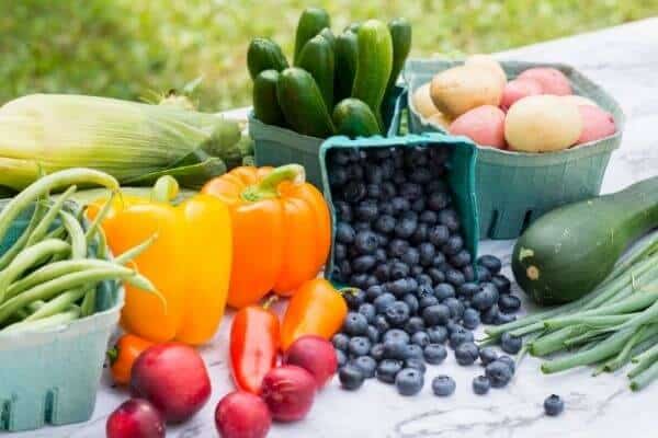 a table with local, seasonal fruit and vegetables