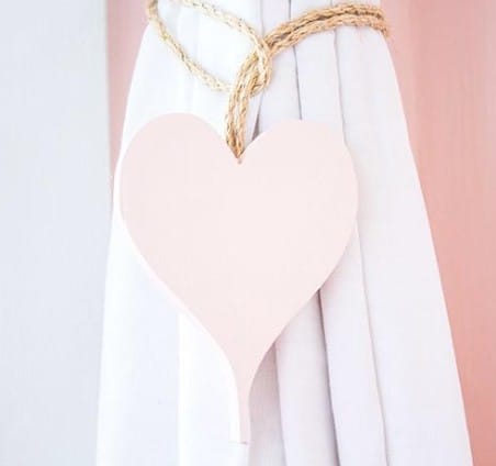 Pink DIY Heart Curtain Ties knotted with jute rope tie back a white curtain