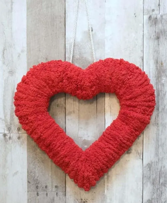 Double-Sided Fluffy Valentine Wreath displayed against a wooden background