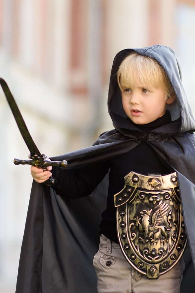 It's easier to follow your kids' passions when you're not tied down to a curriculum. Here, a young boy dresses up like a knight from some make believe play. 