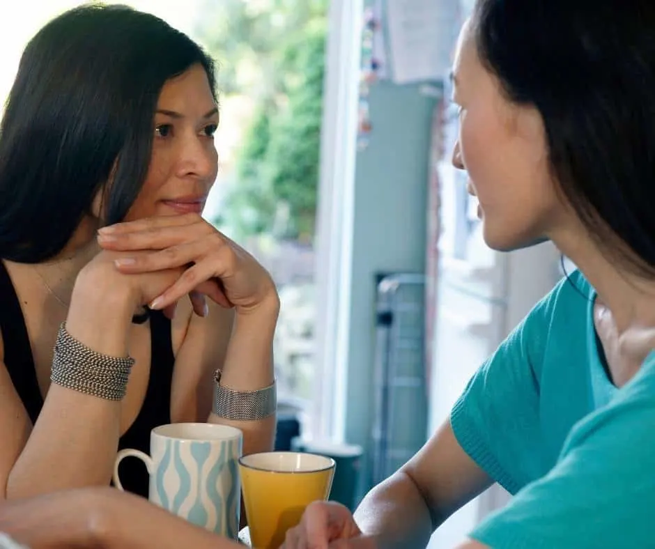 Two women deep in conversation over cups of tea. Hospitality isn't about organizing fancy dinner parties for lots of guests. It's about opening up your heart and home in order to connect with other people. 