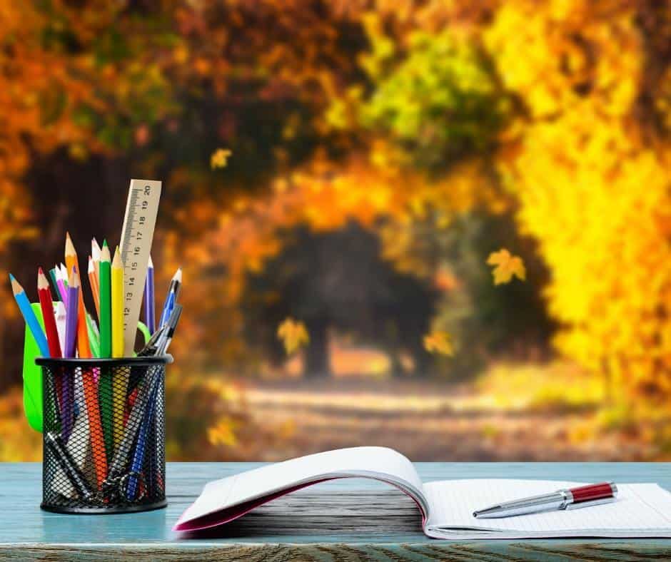 A desk sits in the forest with an open notebook and a jar of colored pencils. Taking our lessons or studies outdoors is the perfect way to celebrate the National Day of Unplugging. Let's ditch the devices and reconnect with nature and the people we love. 