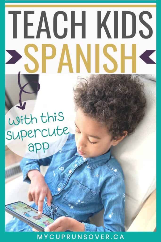 A little girl sitting in a chair playing with a Spanish learning app on a smartphone. Text overlay: Teach Kids Spanish with this supercute app