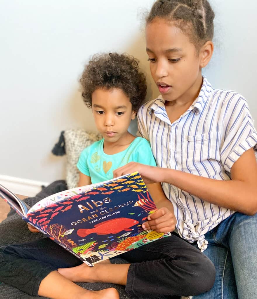 two children read Alba and the Ocean Cleanup-a perfect Earth Day read aloud