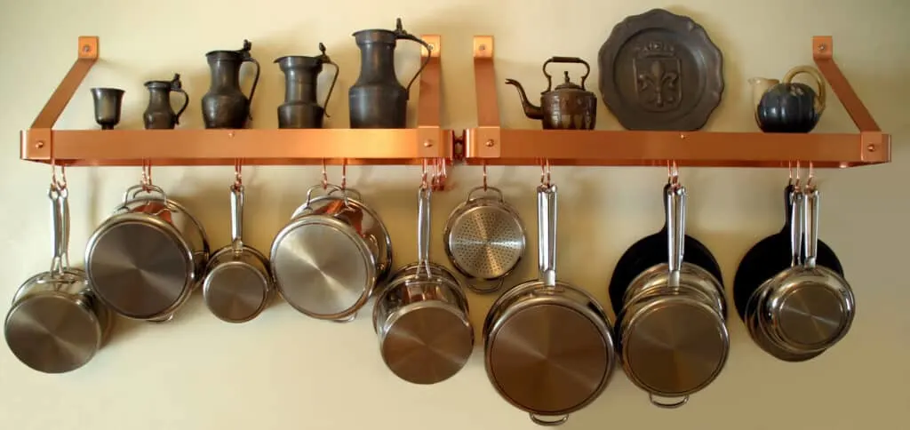 Organize your kitchen by hanging your pot and pans from a mounted rack