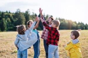 Group of kids in a big family playing together