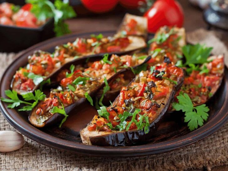 a mediterranean themed eggplant dish with tomatoes and parsley | eggplant is a perfect ingredient for a Mediterranean-themed Vegetarian Easter Dinner