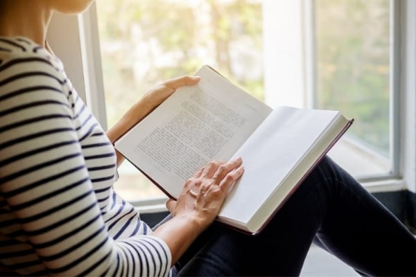 a woman reads a book