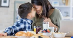 a woman and her son share a healthy breakfast | starting the day with a nutritious meal is one of the best habits for a healthy morning routine