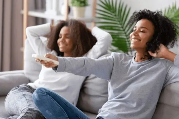 how to connect with your teen - a mother and daughter watch a movie together