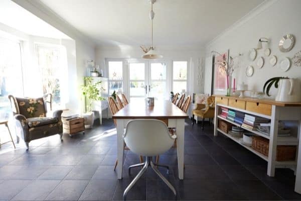 how to start organizing a messy house | dining room with storage shelves to help keep the table clear