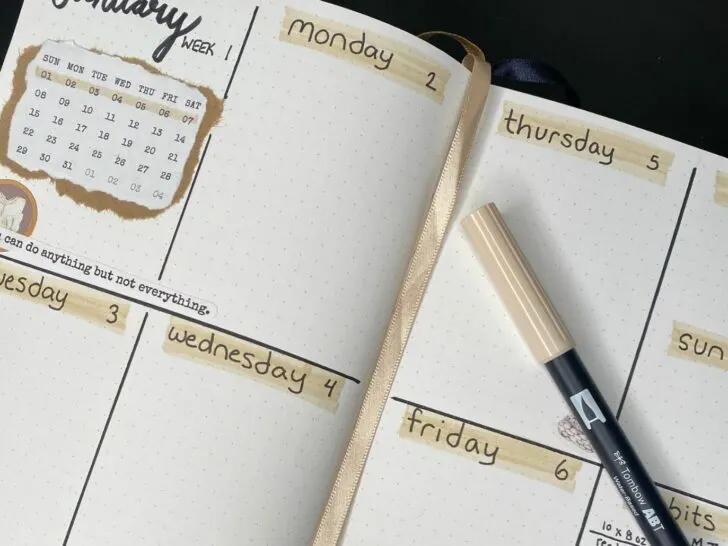 a close-up shot of a minimalist bullet journal weekly spread