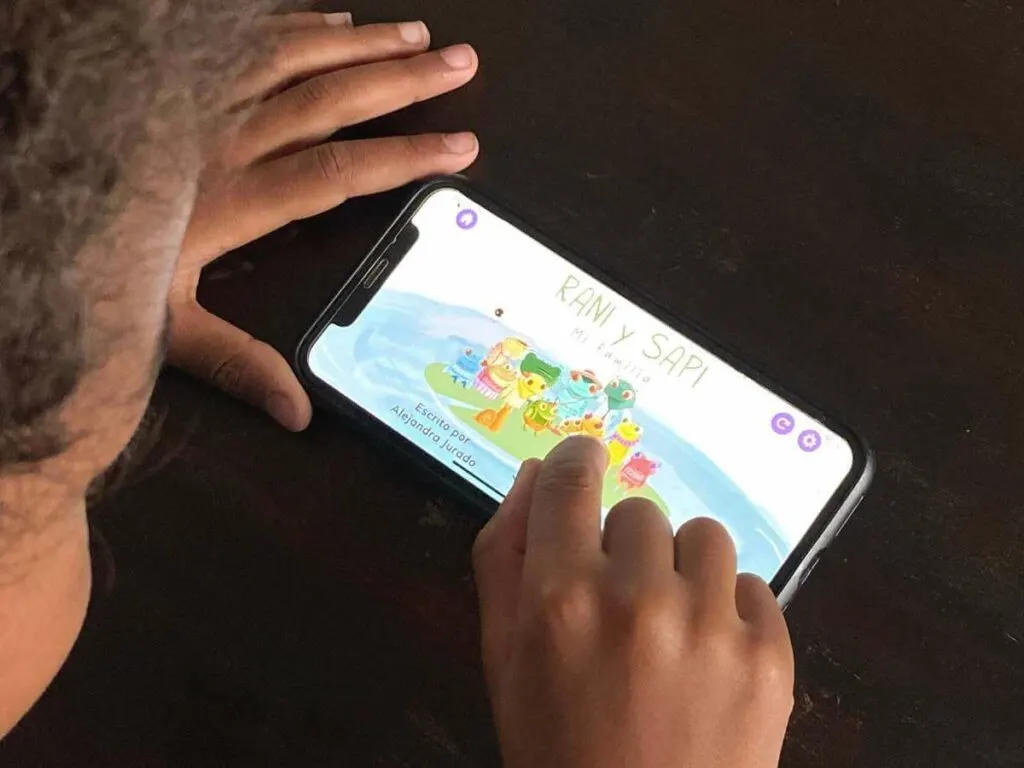 a little boy plays with an online homeschool spanish curriculum