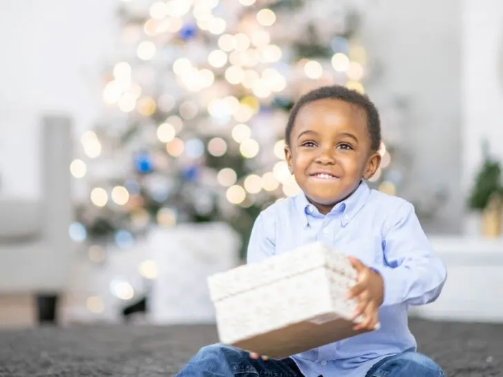 a little boy opens a gift