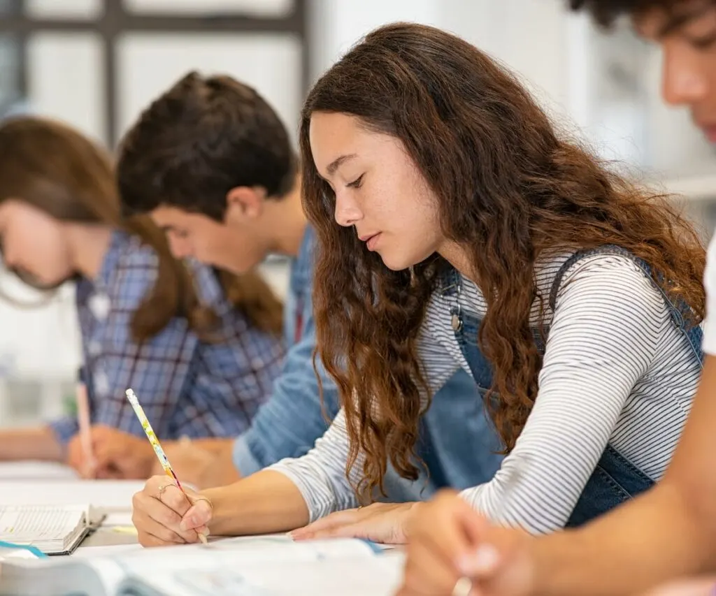 a teen girl takes an art class