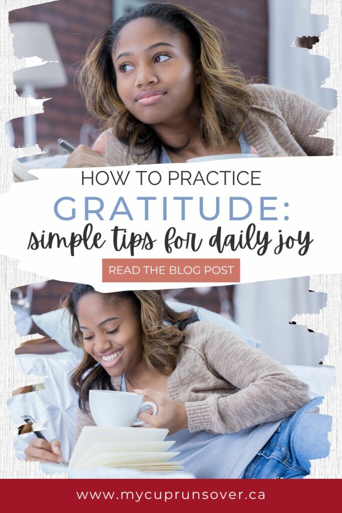 a woman lies on a bed and writes in a gratitude journal while holding a cup